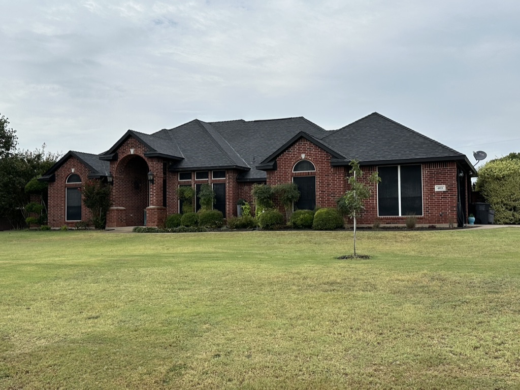 Black Shingle Roof On A Brick Home photo 10