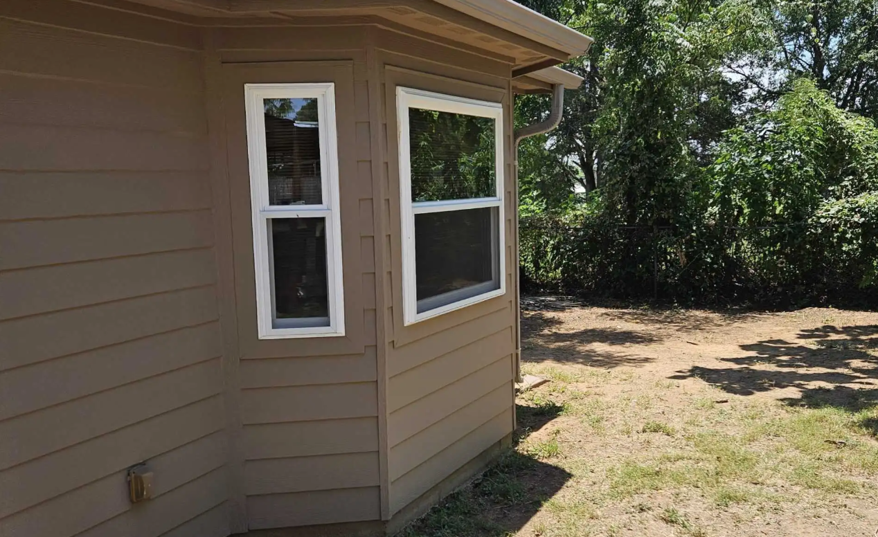 Freshly installed engineered wood siding and trim on a Johnson County home