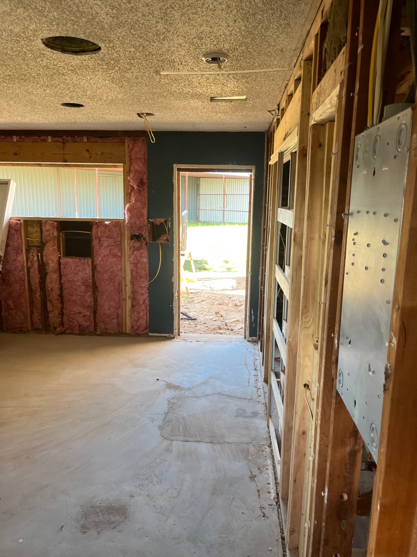 Fresh batt insulation going into the walls of a Johnson County remodel