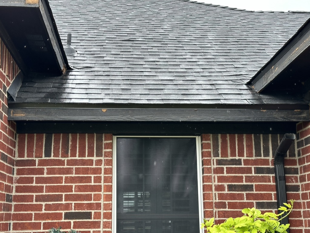 Black Shingle Roof On A Brick Home photo 9