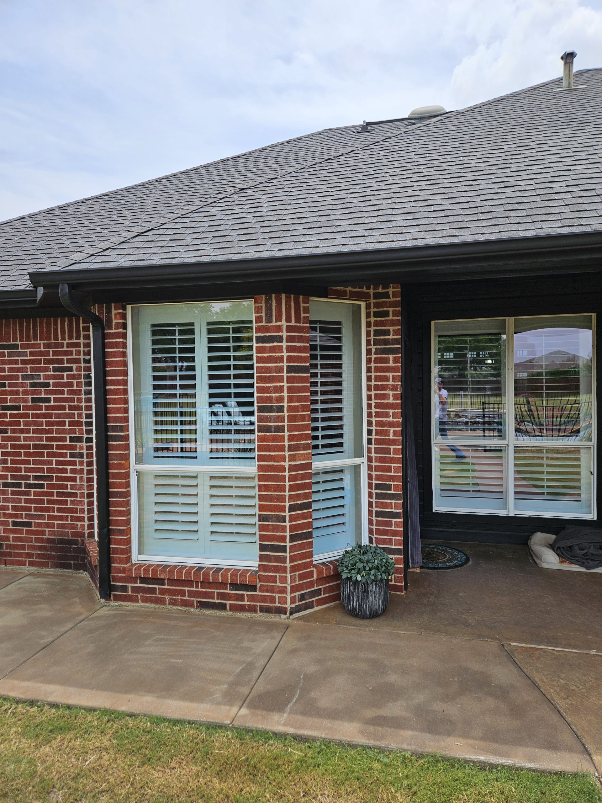 Black Shingle Roof On A Brick Home photo 16