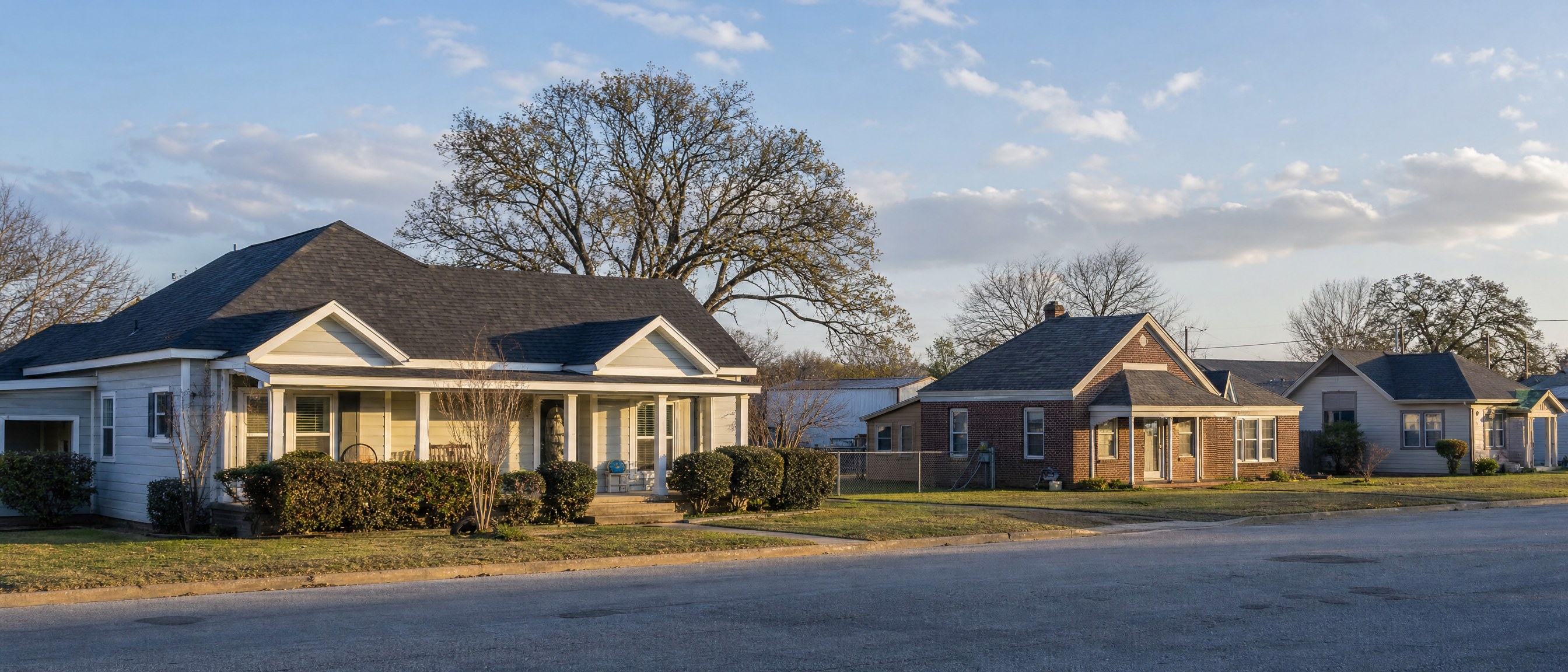 Older homes along a small-town residential street in Grandview, TX