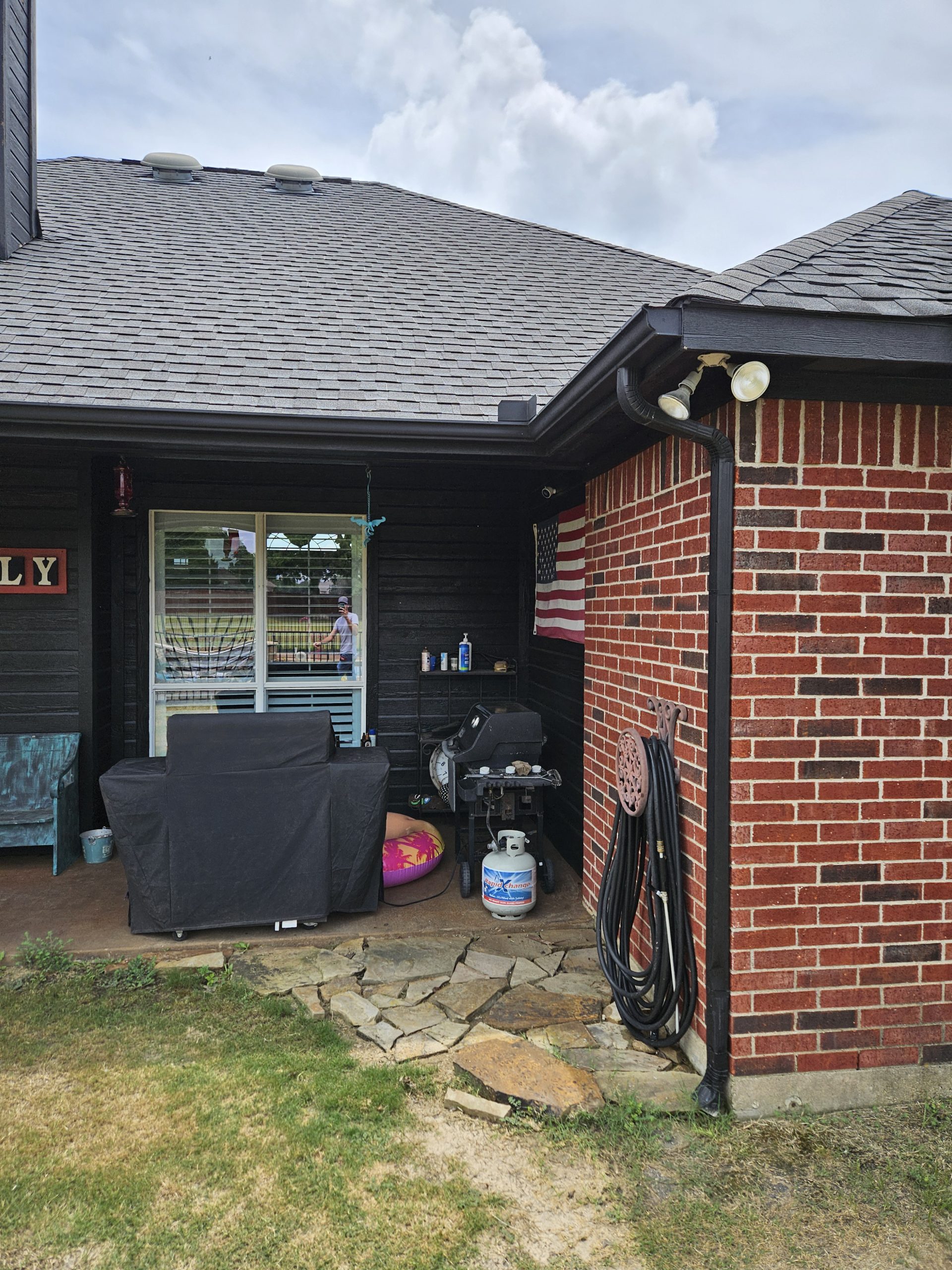 Black Shingle Roof On A Brick Home photo 6