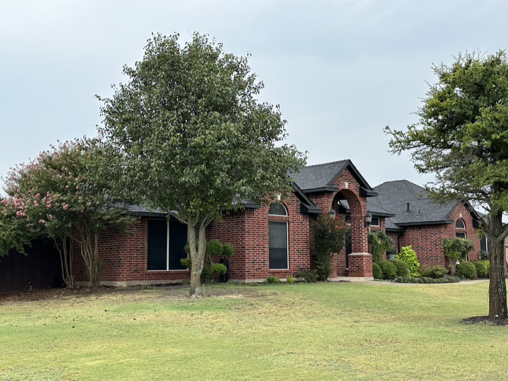 Black Shingle Roof On A Brick Home photo 8