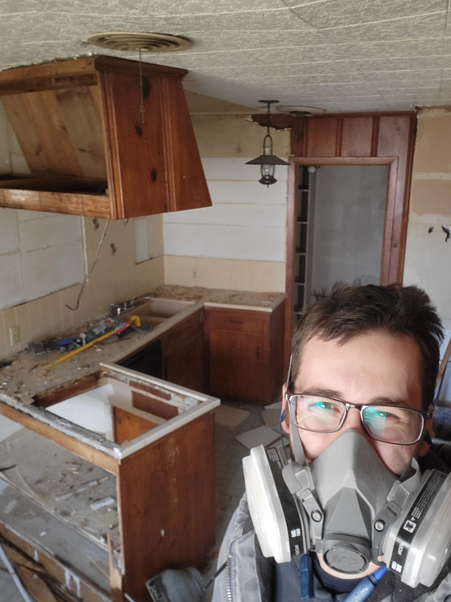 W2 Construction crew mid demo on a dated Johnson County kitchen