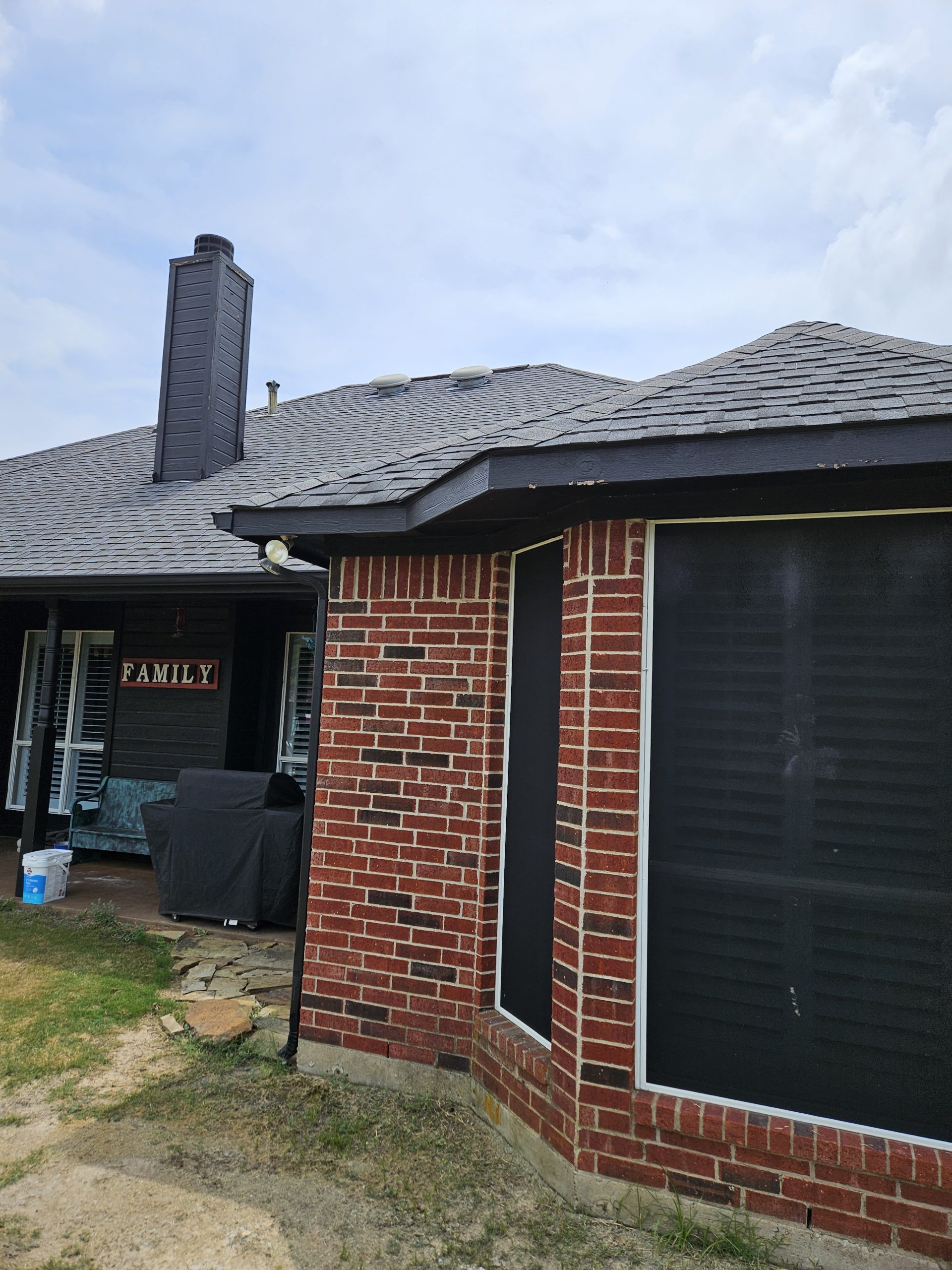 Black Shingle Roof On A Brick Home photo 13