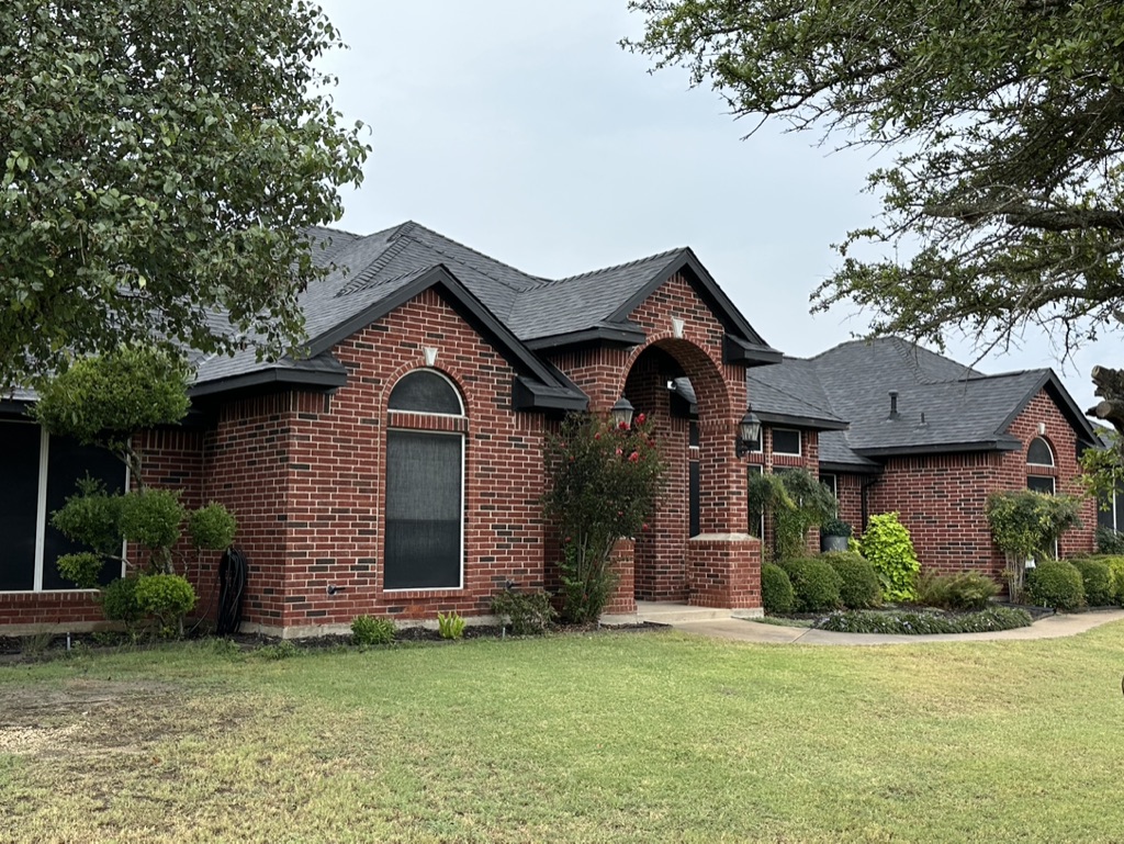 Black Shingle Roof On A Brick Home photo 7
