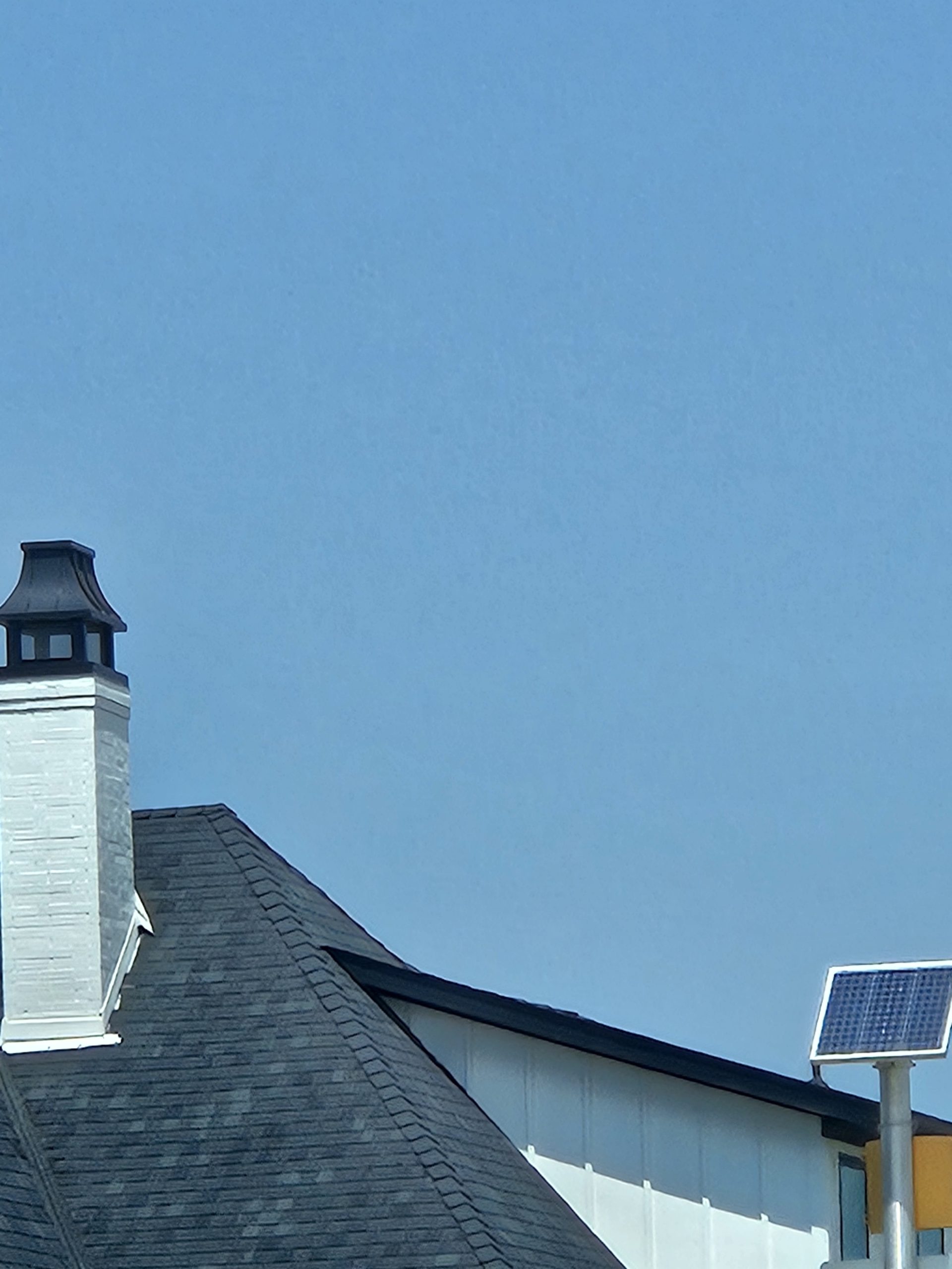 Black Shingle Roof On A Brick Home photo 22