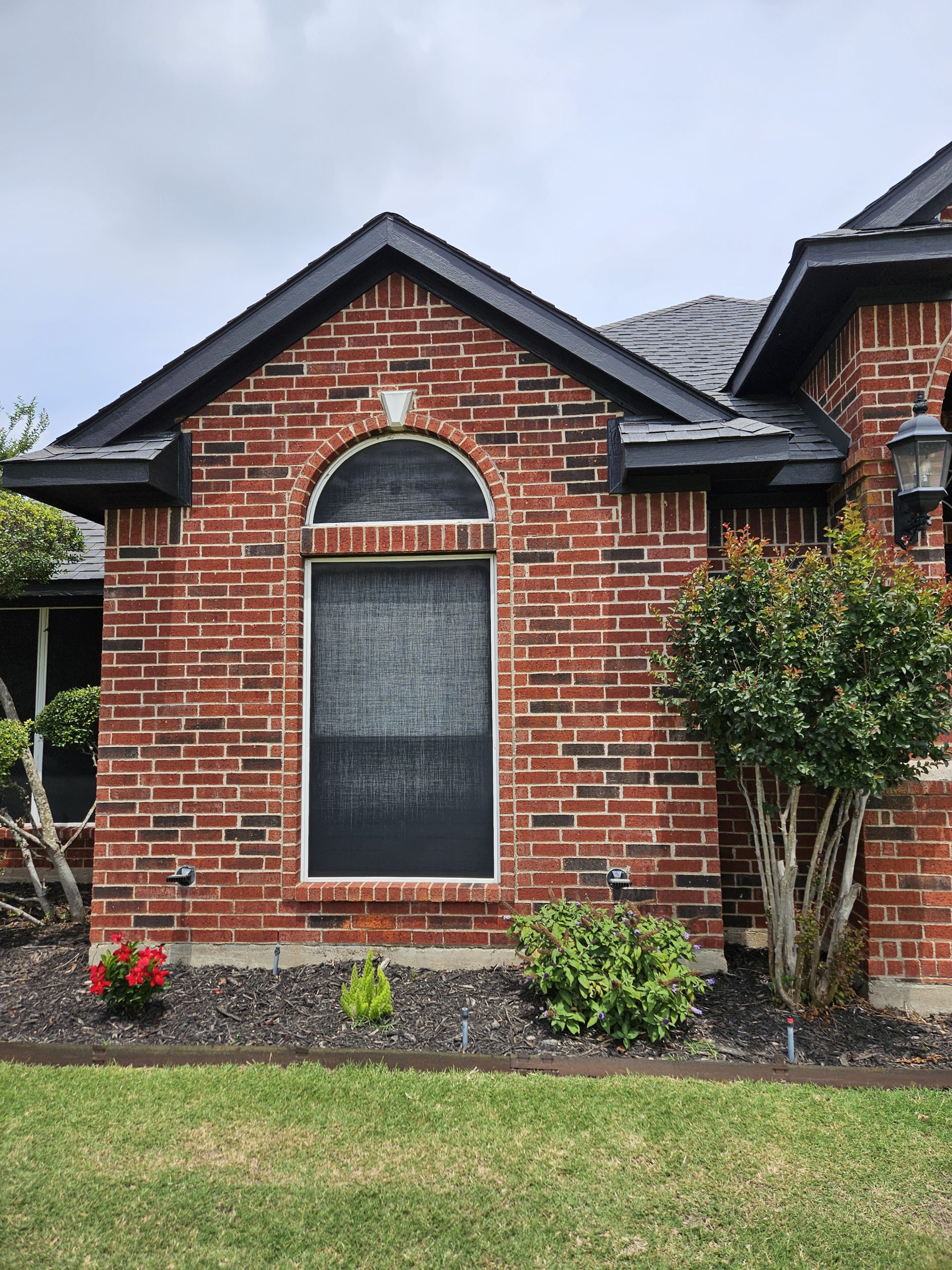 Black Shingle Roof On A Brick Home photo 11
