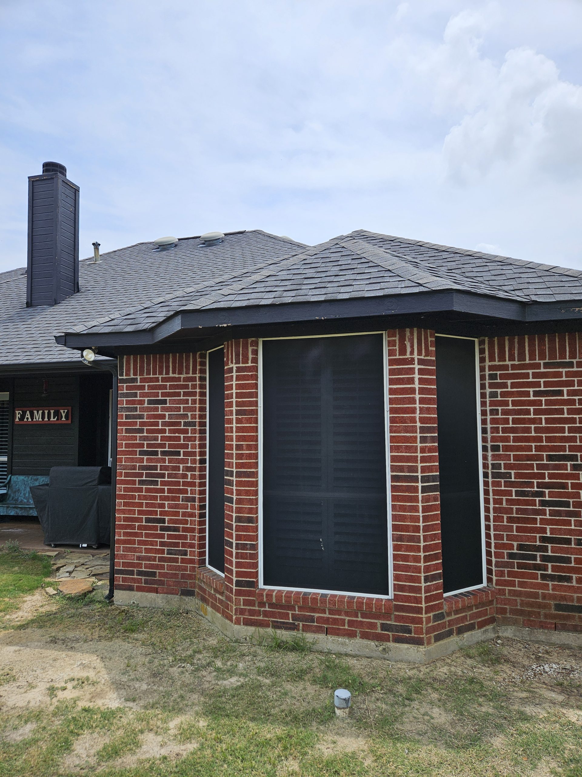 Black Shingle Roof On A Brick Home photo 12