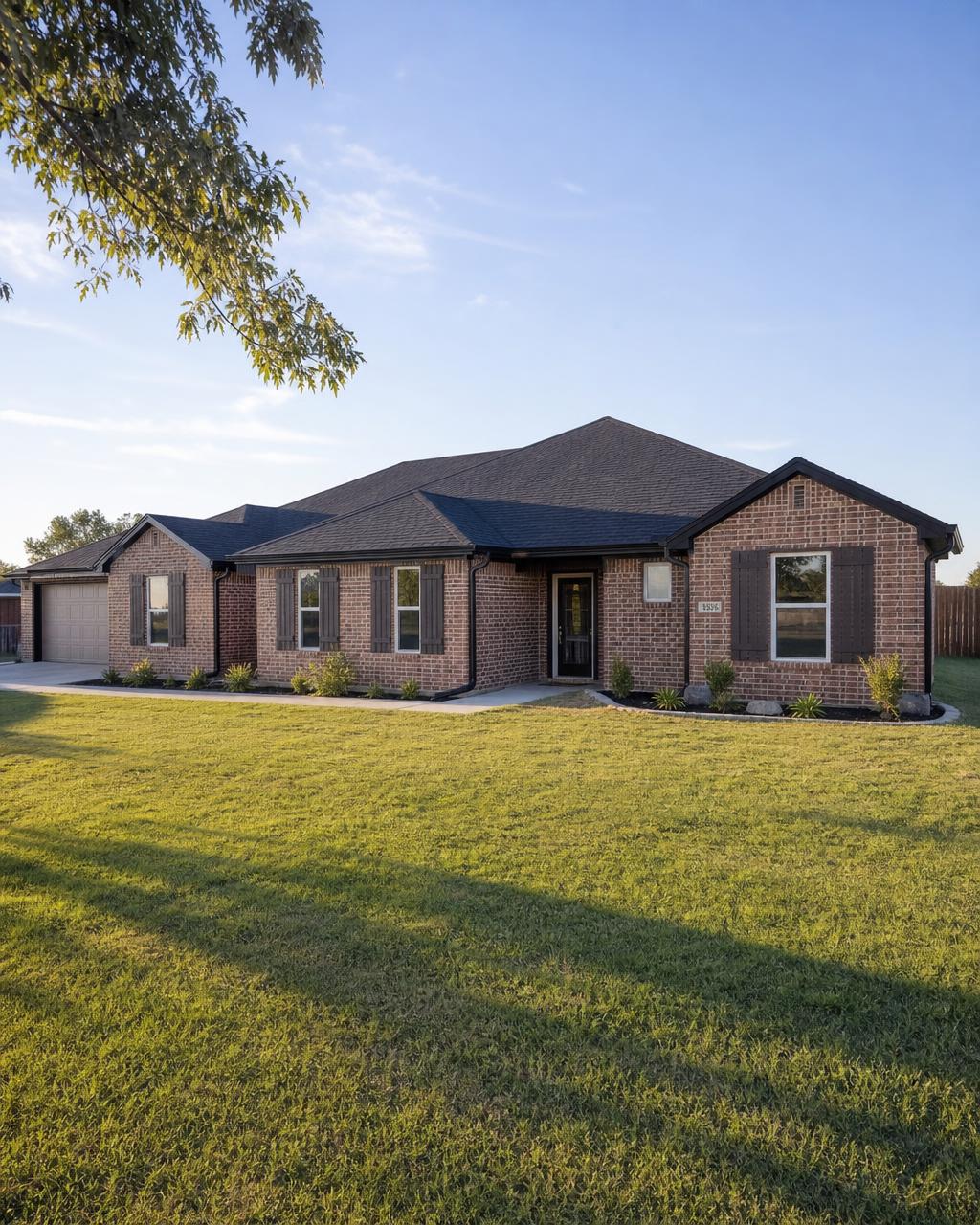 New roof and seamless gutters on a brick ranch home in Joshua, TX